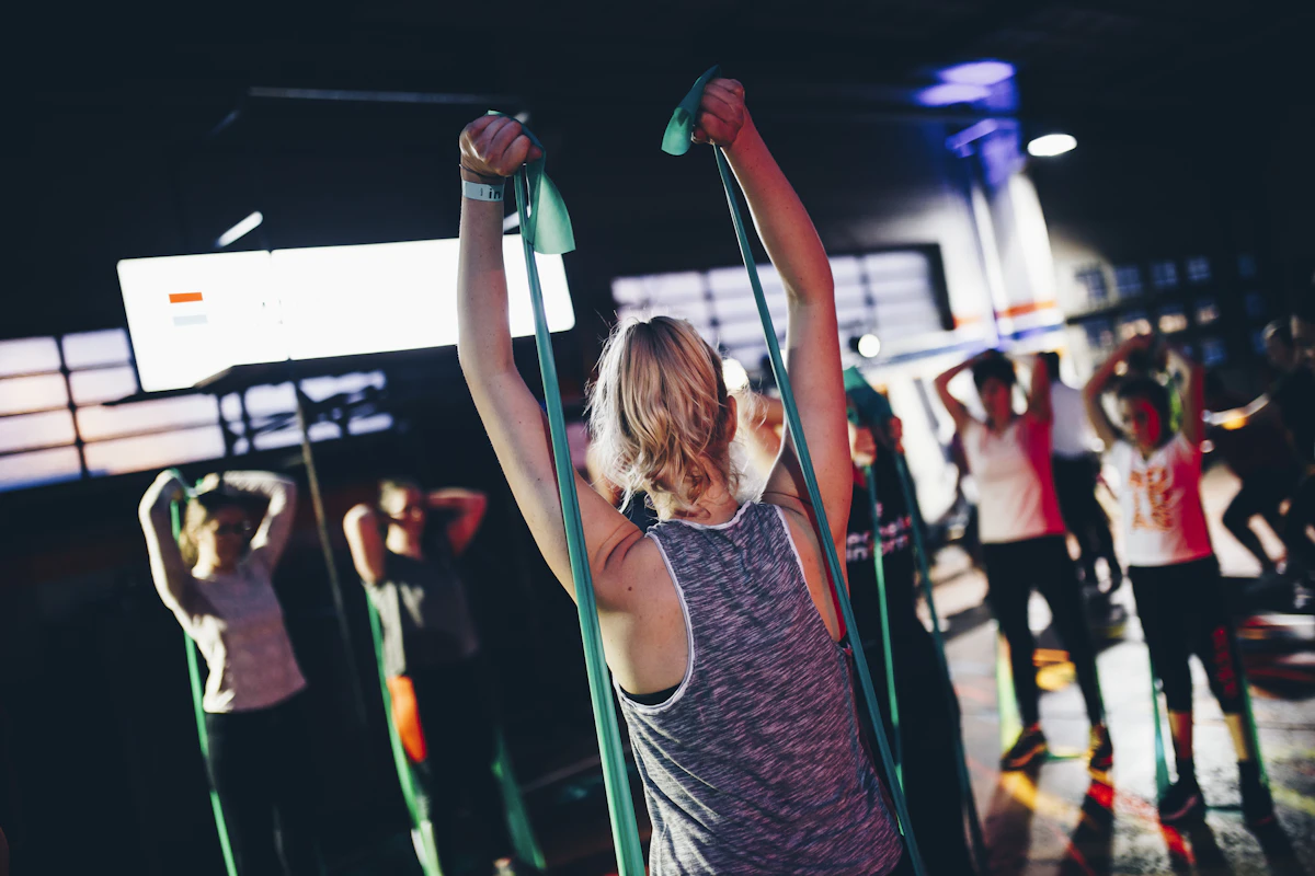 A group class mid-workout on the gym floor