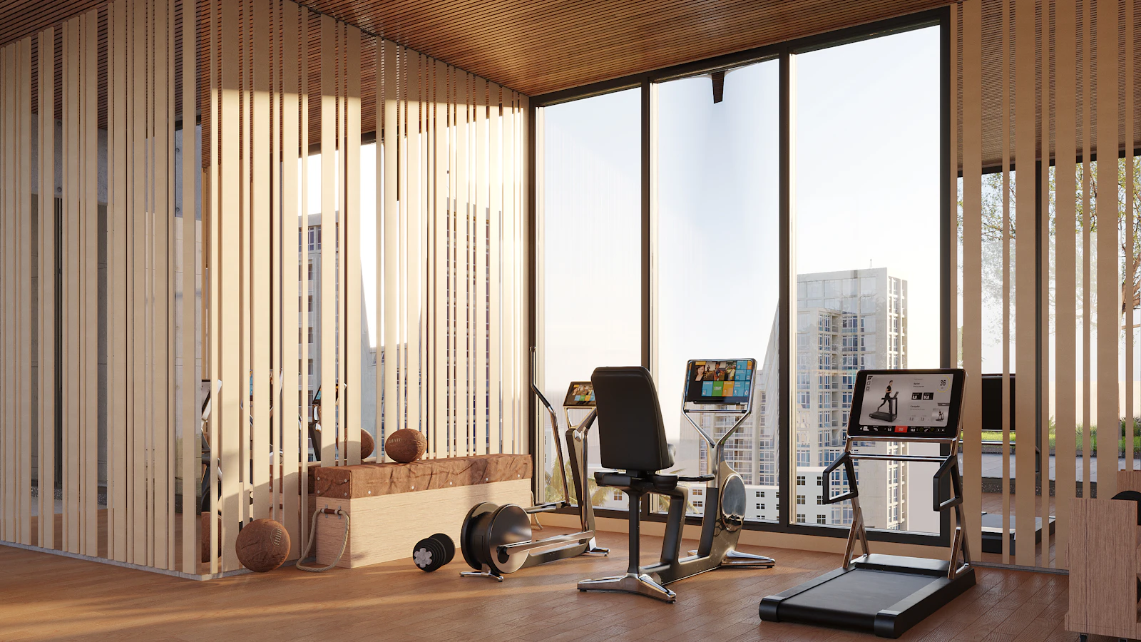 A modern gym floor with rows of equipment under floor-to-ceiling windows